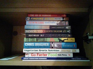 Inspirational running books on David Sawyer's shelves.